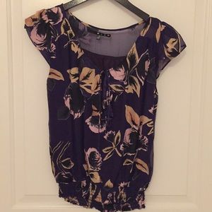 Purple floral silk blouse.